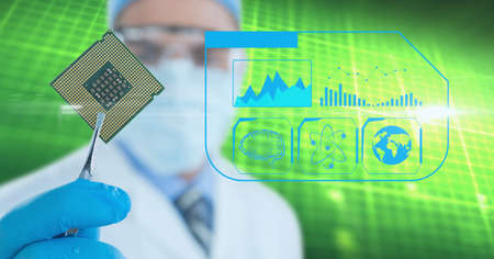 Medical icons over male doctor wearing face mask holding computer chip against green background....
