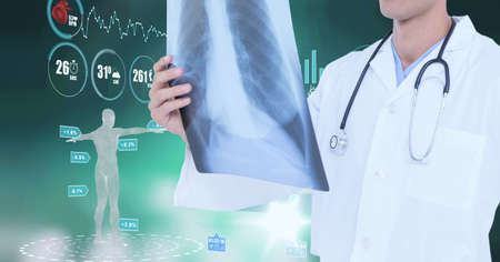 Medical data processing against mid section of male doctor examining x-ray report. medical research...