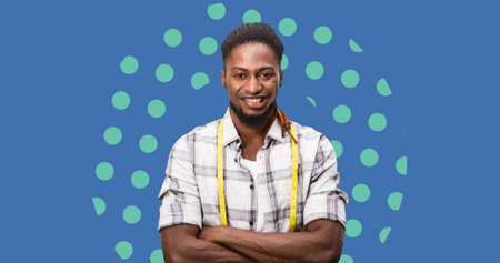 Composition of male fashion designer smiling on blue background. fashion design, fashion show and clothing concept digital image.の写真素材