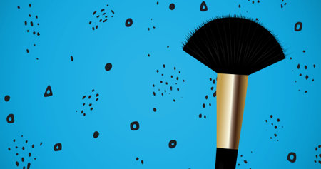 Composition of make up brush with shapes repeated on blue background. fashion and accessories background pattern concept digital image.の写真素材