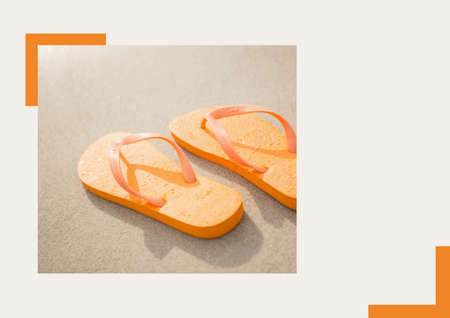 Photograph of orange flip flops at the beach against grey background. summer holiday and vacation...