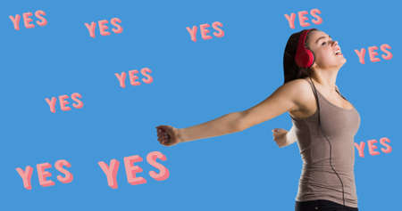 Composition of yes text over girl with headphones. girl power, positive female strength and independence concept digitally generated image.の写真素材