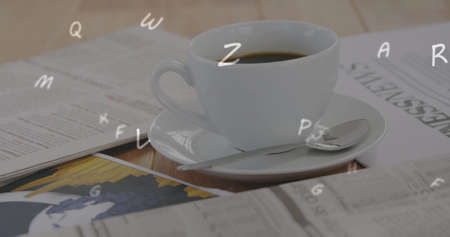 Digital composition of multiple alphabets floating against cup of coffee and documents on wooden surface. school and education conceptの写真素材