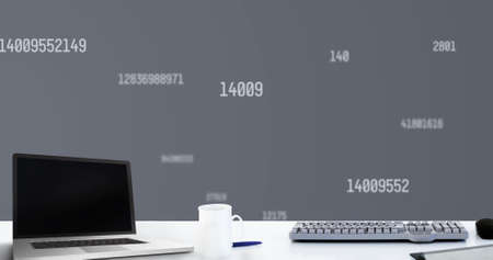 Digital image of laptop and coffee cup multiple changing numbers and symbols on grey background. school and education conceptの写真素材
