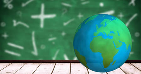 Digital image of spinning globe on wooden surface against mathematical symbols on green background. school and education conceptの写真素材