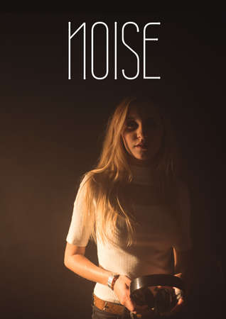 Composition of music event text over woman holding headphones. event promotional communication...