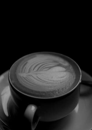 Composition of cup of coffee on black background. health, leisure and entertainment concept digitally generated image.の写真素材
