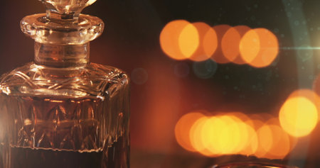 Image of wine decanter over christmas flickering lights. christmas festivity celebration concept...