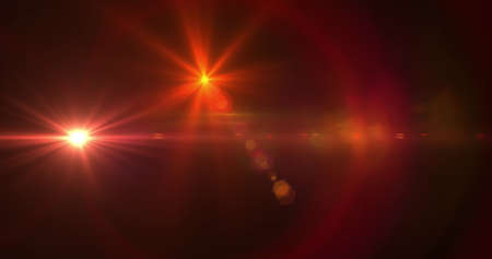 Image of glowing red spots of light lens flare moving in hypnotic motion in seamless loop on black background. Light colour and movement concept digitally generated image.の写真素材