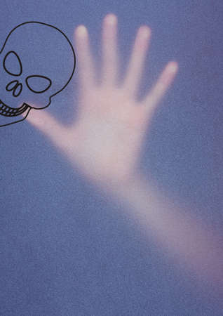 Human skull icon and noise effect overlay over trapped hand against blue background. danger and caution vector illustration and art conceptの写真素材