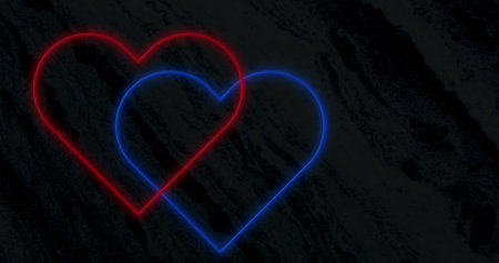 Image of interlocked red and blue neon hearts flashing on black background. valentines day, love and romance concept, digitally generated image.の写真素材
