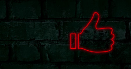 Image of red neon social media icons flashing on dark brick wall. social media communication concept, digitally generated image.の写真素材