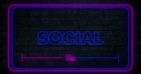 Digital image of purple and blue neon social distancing text against brick wall. virus pandemic conceptの写真素材
