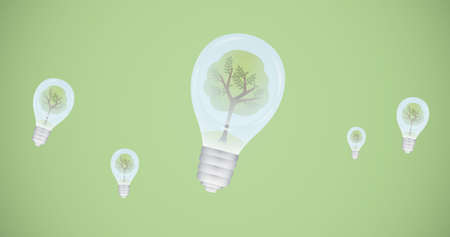 Composition of trees in light bulbs over green background on. global conservation and earth day concept digitally generated image.の写真素材