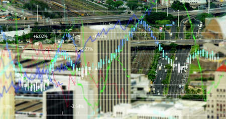Image of financial data processing over urban cityscape and road traffic in fast motion in the...