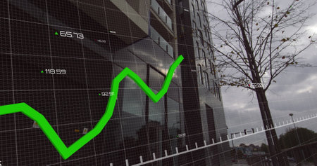 Image of financial data processing with green lines over modern building in the background. Global business finance housing market concept digital composite.の写真素材