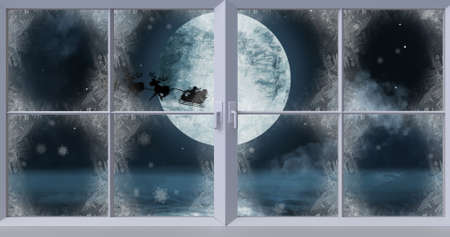 Image of silhouette of santa claus in sleigh being pulled by reindeer and winter christmas scenery...