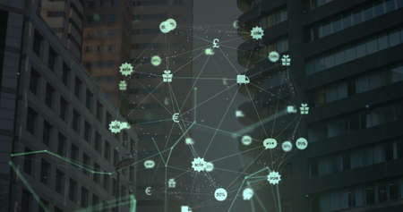 Digital composite image of globe of green digital icons and network of connections against tall buildings in background. Global networking and logistics conceptの写真素材