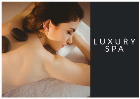Luxury spa text banner over woman lying for a massage against black background. spa, wellness and relaxation conceptの写真素材