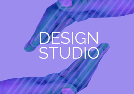 Digitally generated image of design studio text over two hands against purple background. creative...