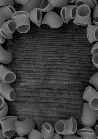 Composition of close up of black and white pasta on gray background. food menu and template concept digitally generated image.の写真素材