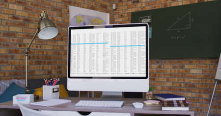 Computer screen with data processing standing on desk in office. computer coding, data technology...