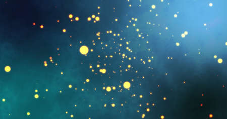 Image of warm glowing yellow spots floating on blue background. light, colour and movement concept...