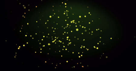Image of warm glowing yellow spots on green background. light, colour and movement concept digitally generated image.の写真素材