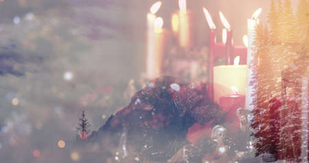 Image of winter landscape over christmas candles. christmas, tradition and celebration concept digitally generated image.の写真素材