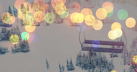 Image of winter landscape over blurred christmas lights. christmas, tradition and celebration concept digitally generated image.の写真素材