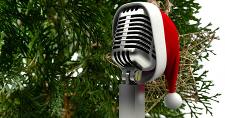 Image of santa hat on vintage microphone over fir tree on white background. christmas, tradition and celebration concept digitally generated image.の写真素材