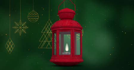 Image of red lantenr over christmas tree decorations on green background. christmas, tradition and celebration concept digitally generated image.の写真素材
