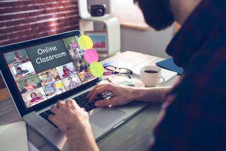 Photography apps against midsection of creative editor typing on laptopの写真素材