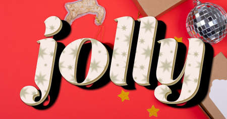 Composition of jolly text over christmas decorations on red background. christmas, winter, tradition and celebration concept digitally generated imageの写真素材