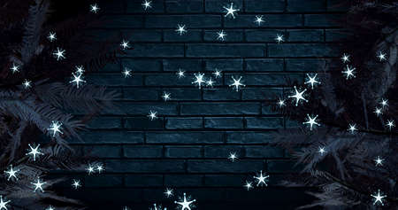 Image of snow falling at christmas over fir trees. christmas, winter, tradition and celebration concept digitally generated image.の写真素材