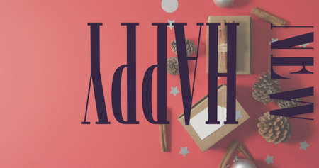 Image of merry christmas text over christmas gifts. christmas, tradition and celebration concept digitally generated image.の写真素材