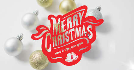 Image of merry christmas text over baubles. christmas, winter, tradition and celebration concept digitally generated image.の写真素材