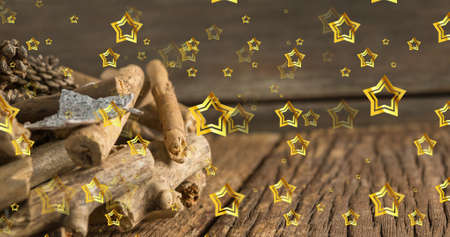 Image of stars falling over pine cones at christmas. christmas, winter, tradition and celebration concept digitally generated image.の写真素材