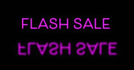 Pink neon Flash Sale text appearing against black backgroundの写真素材