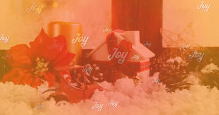 Image of joy text over snow and christmas decorations. christmas, tradition and celebration concept digitally generated image.の写真素材