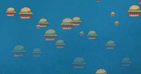 Digital composite image of american hamburger sandwiches against blue abstract background. multiple image, fast food and creativity.の写真素材