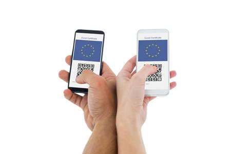 Hands of a couple holding smartphones on white backgroundの写真素材