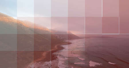 Image of american flag in circle and blue square grid over ocean coastline and blue sky. patriotism, independence and celebration concept digitally generated image.の写真素材