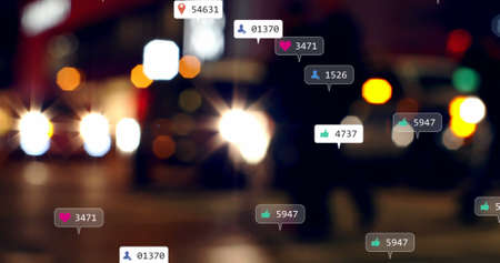 Image of social media icons and numbers over out of focus city and traffic lights. global social media, connections and digital interface concept digitally generated image.の写真素材