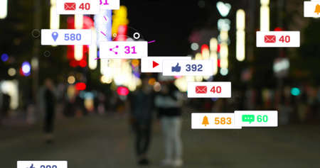 Image of social media icons and numbers over out of focus city and traffic lights. global social...