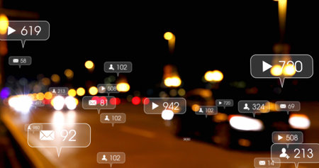 Image of social media icons and numbers over out of focus city and traffic lights. global social media, connections and digital interface concept digitally generated image.の写真素材