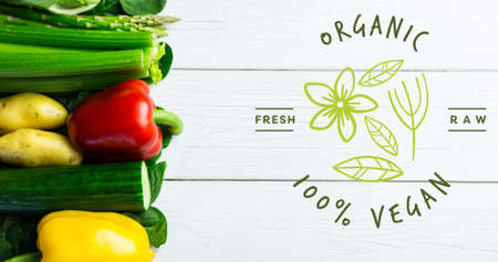 Overhead view of fresh vegetables with organic vegan text sign on wooden table. digital composite of healthy food and sign.の写真素材
