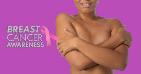 Composite image of smiling topless woman hugging self against purple background. breast cancer awareness campaign and vector concept.の写真素材