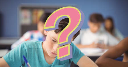Digital composite of pink question mark over schoolboy writing with friends in classroom. education and knowledge.の写真素材