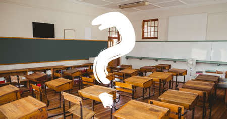 Digital composite of question mark over empty desk arranged in classroom at school. education and...